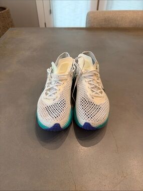 Nike Women's Light Gray Knit Running Shoes with Teal & Purple Accents